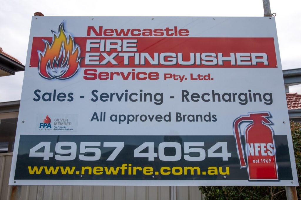 newcastle fire extinguisher service sign